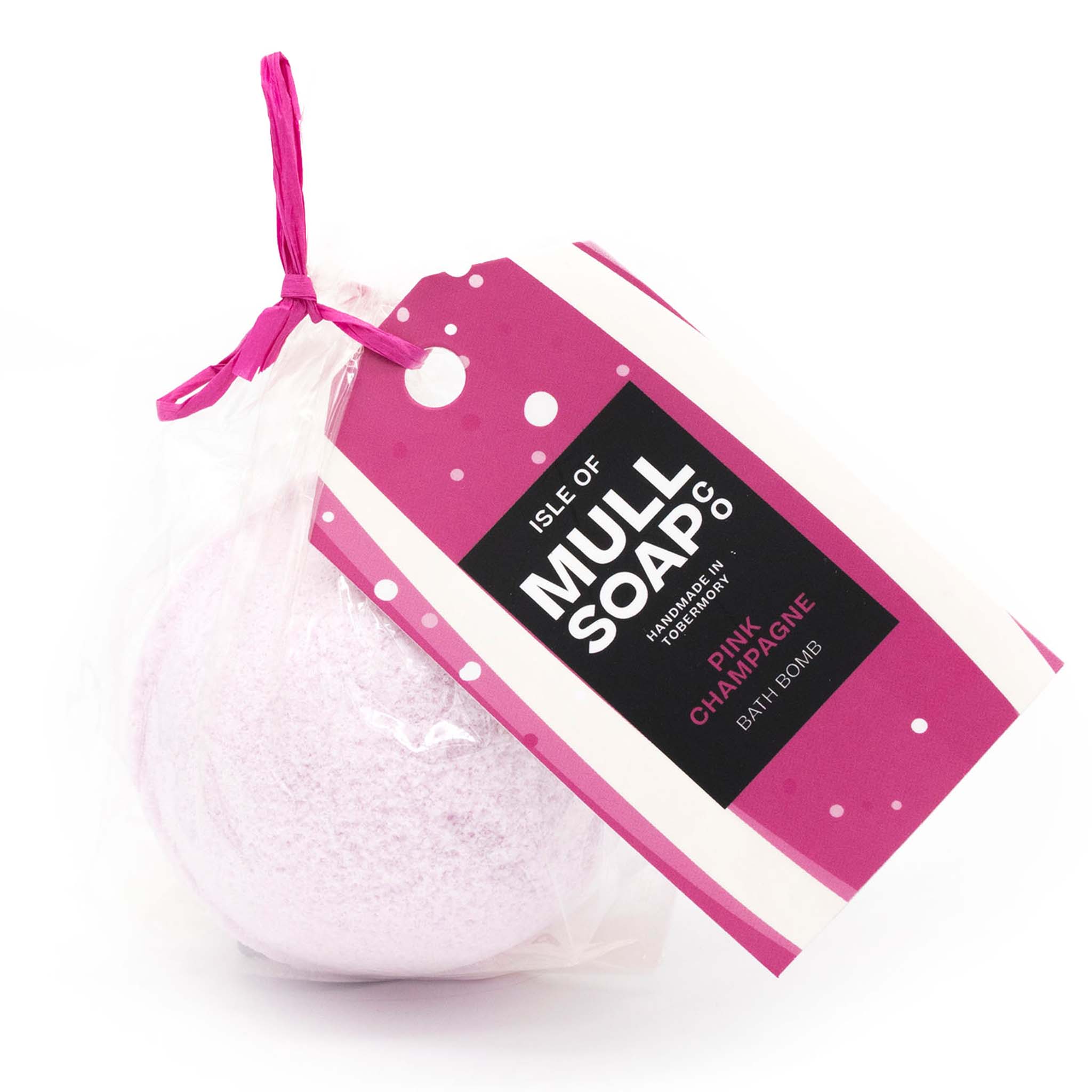 pink coloured round pink champagne bath bomb presented as a gift in a bag with coloured tag and bow. Handmade by the Isle of Mull soap co in Tobermory, Scotland.