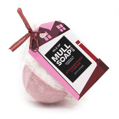 half white and half red coloured round strawberries and cream bath bomb presented as a gift in a bag with coloured tag and bow. Handmade by the Isle of Mull soap co in Tobermory, Scotland.