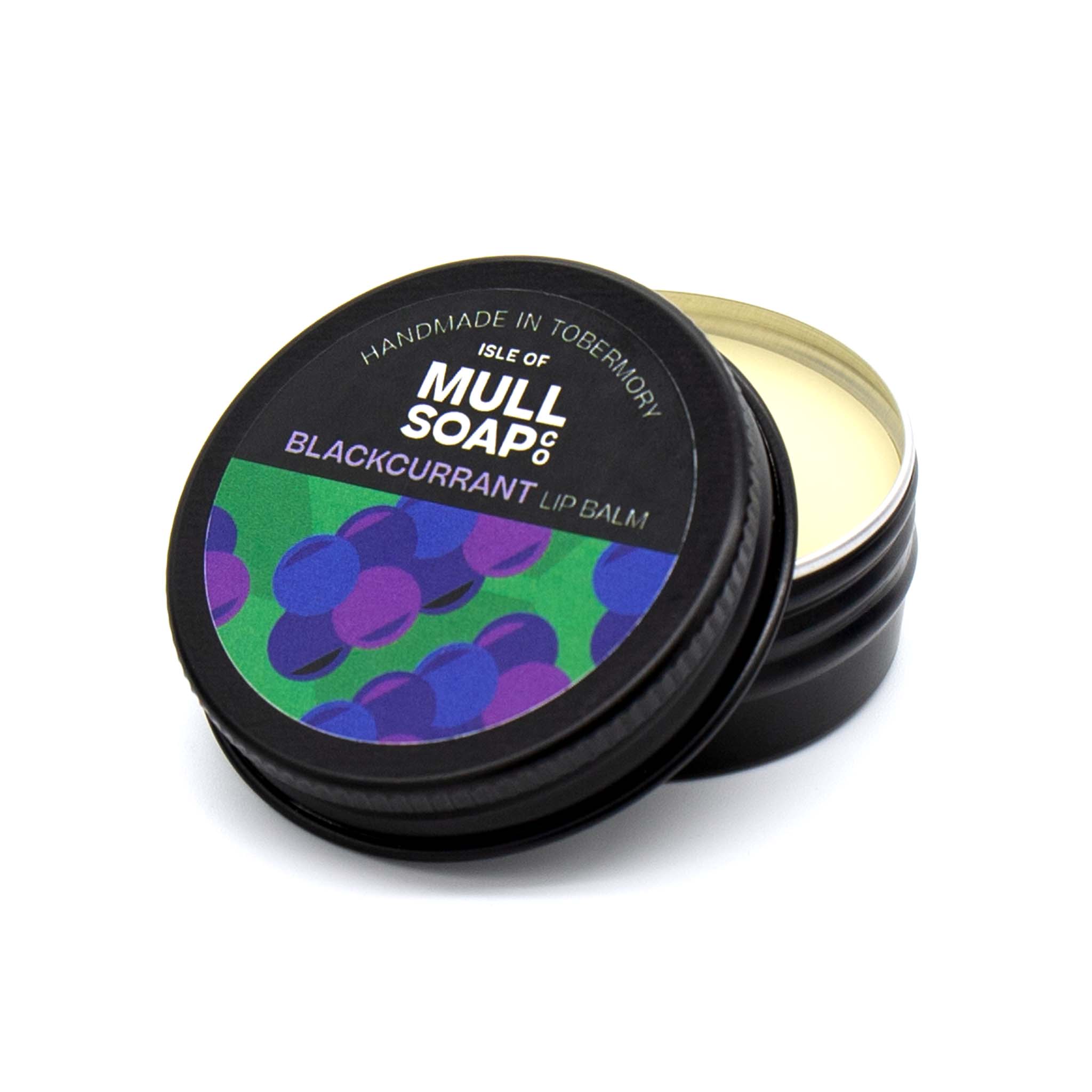 blackcurrant lip balm in a black tin with colourful label. vegan lip balm handmade in Tobermory by the Isle of Mull soap co.