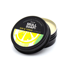 gina and tonic lip balm in a black tin with colourful label. vegan lip balm handmade in Tobermory by the Isle of Mull soap co.