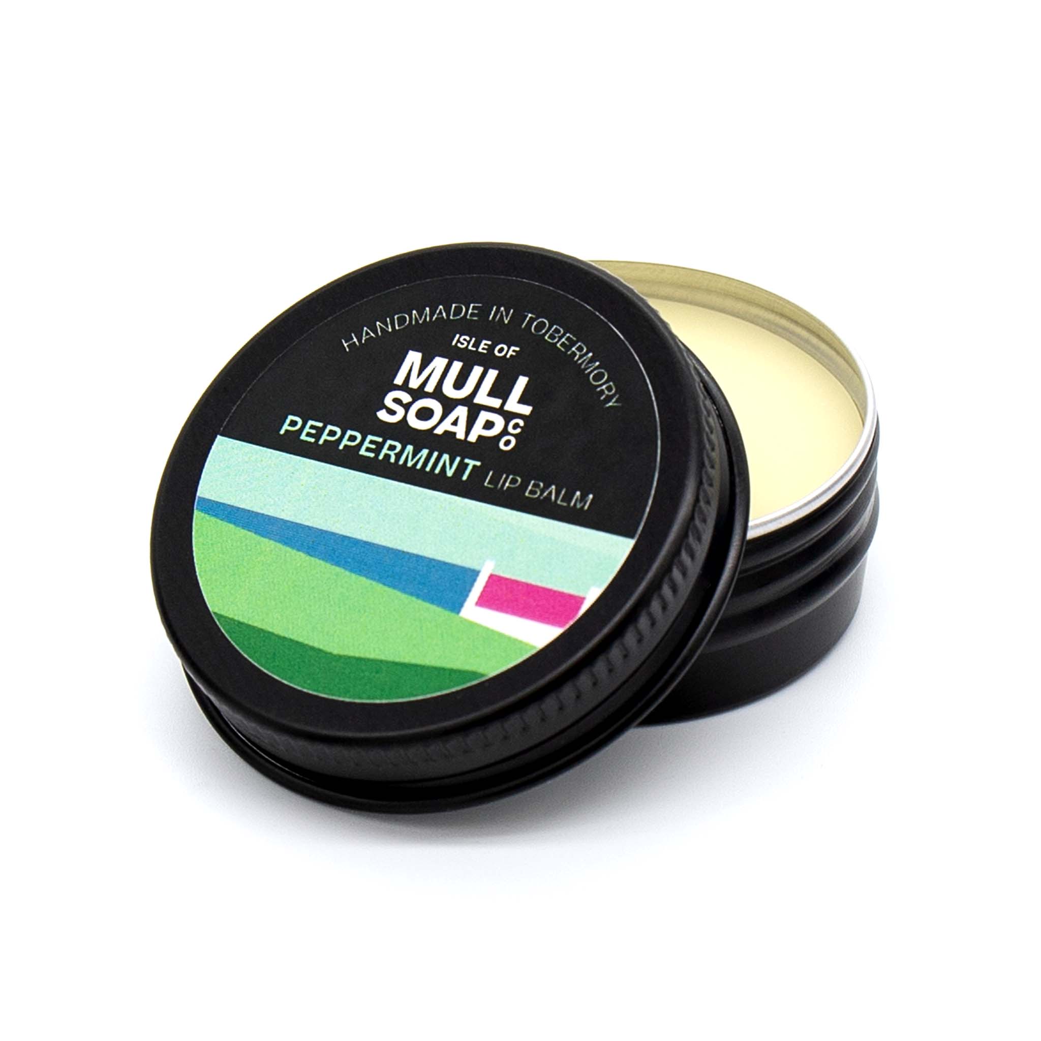 peppermint lip balm in a black tin with colourful label. vegan lip balm handmade in Tobermory by the Isle of Mull soap co.