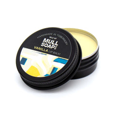vanilla lip balm in a black tin with colourful label. vegan lip balm handmade in Tobermory by the Isle of Mull soap co.