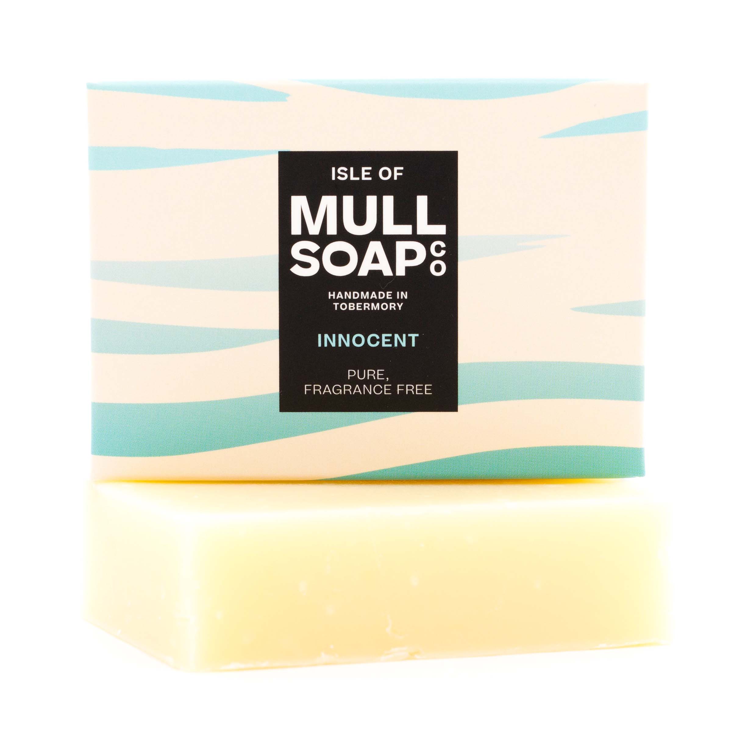 an innocent pure fragrance free soap box sitting on top of the soap bar. The box is waves of white and pale blue green.  Handmade in Tobermory by the Isle of Mull soap co.