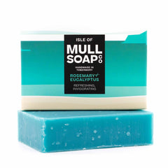 a rosemary and eucalyptus soap box sitting on the green soap bar. The box is a sand and green coloured design. The soap is described as refreshing and invigorating. Handmade in Tobermory by the Isle of Mull soap co.