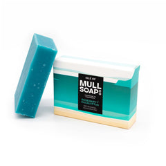 a rosemary and eucalyptus soap box sitting next to the green soap bar. The box is a sand and green coloured design. The soap is described as refreshing and invigorating. Handmade in Tobermory by the Isle of Mull soap co.