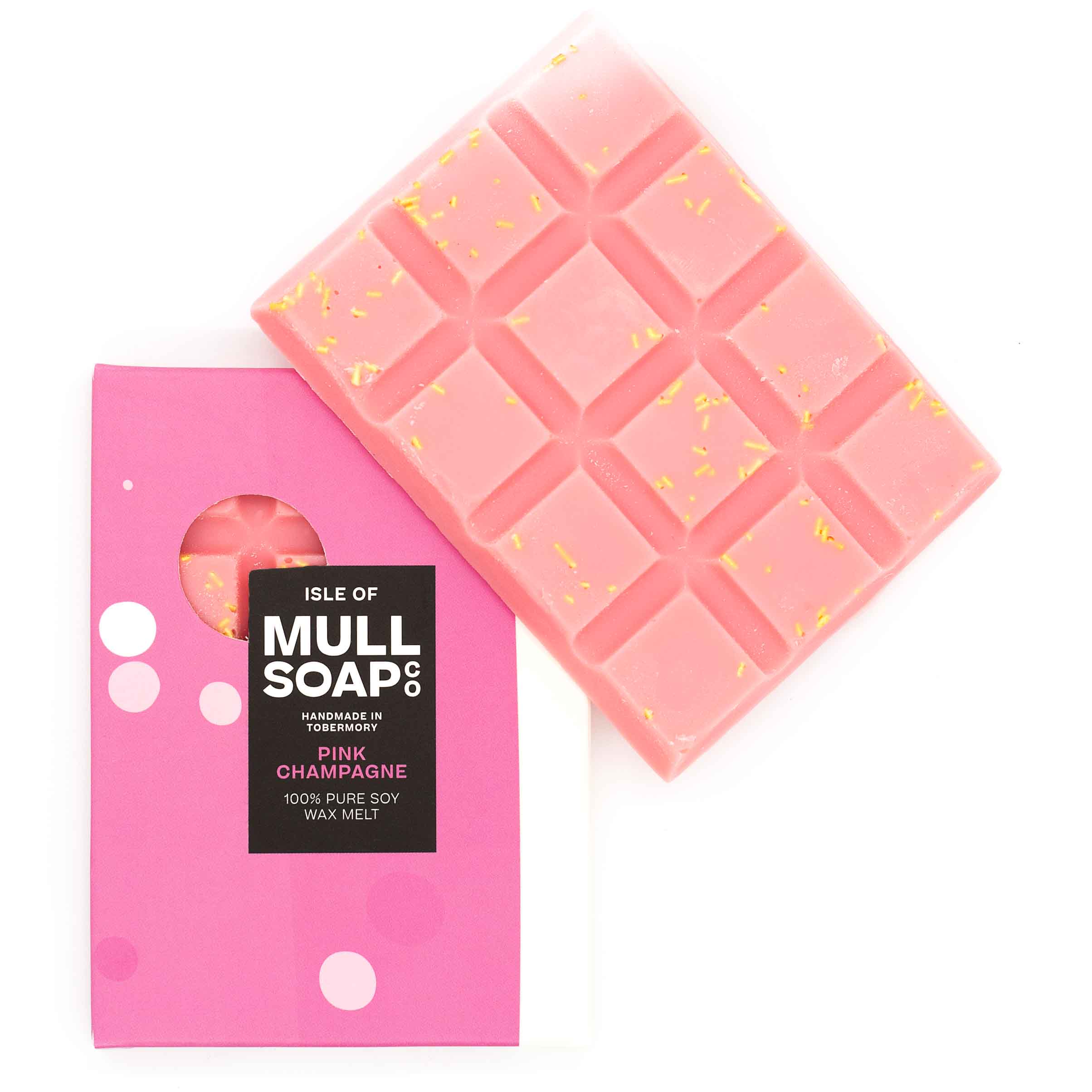 A pale pink Pink Champagne scented soy wax melt snap bar with gold strands sprinkled in. Handmade in Tobermory by the Isle of Mull Soap Co.