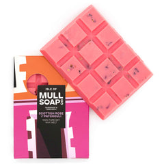 A pink Scottish Rose & Patchouli scented soy wax melt snap bar with rose petals sprinkled in. Handmade in Tobermory by the Isle of Mull Soap Co.