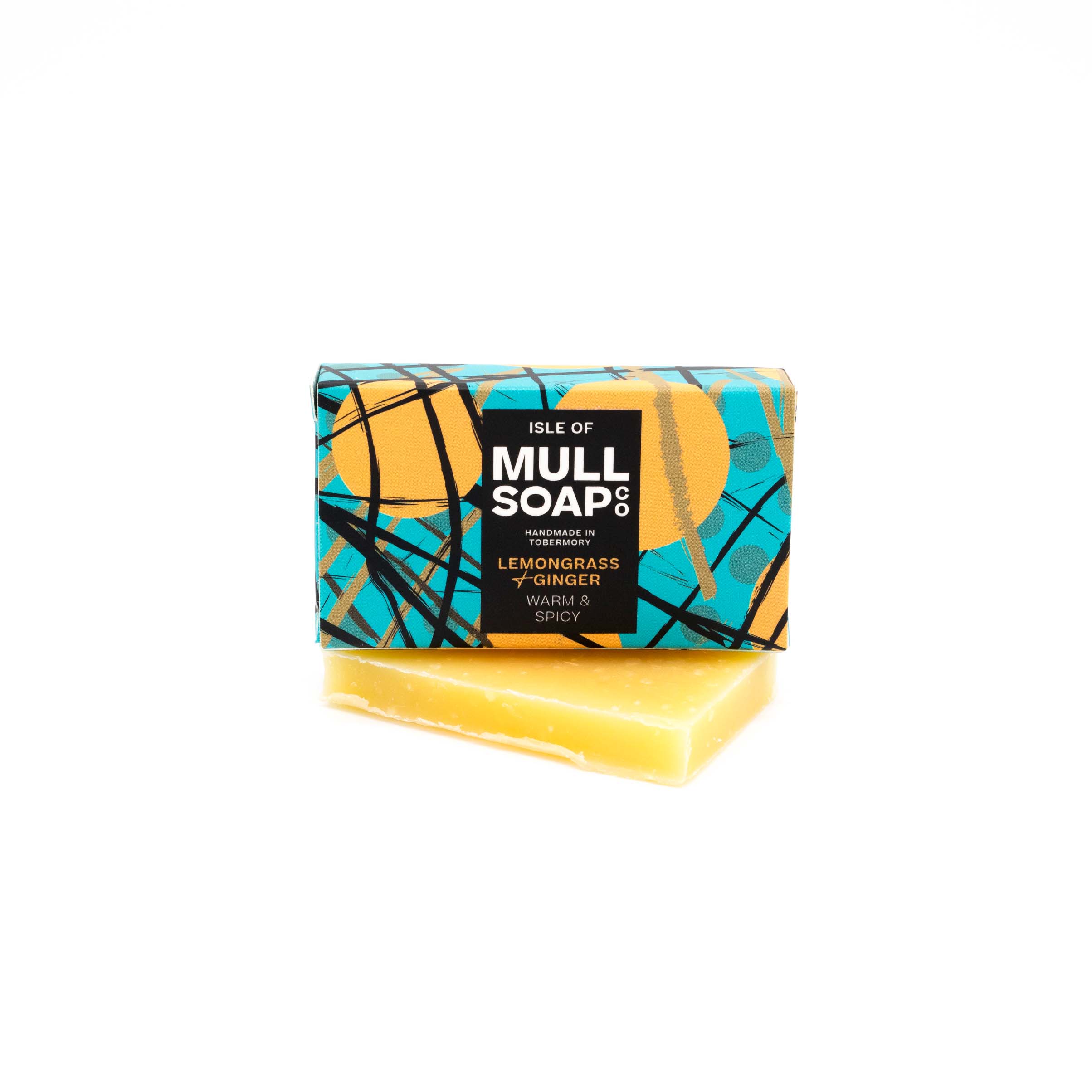 A lemongrass & Ginger mini soap box sitting on a mini soap bar. Soap described as warm and spicy. Handmade natural soap made by the isle of mull soap co in Tobermory.