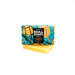A lemongrass & Ginger mini soap box sitting on a mini soap bar. Soap described as warm and spicy. Handmade natural soap made by the isle of mull soap co in Tobermory.