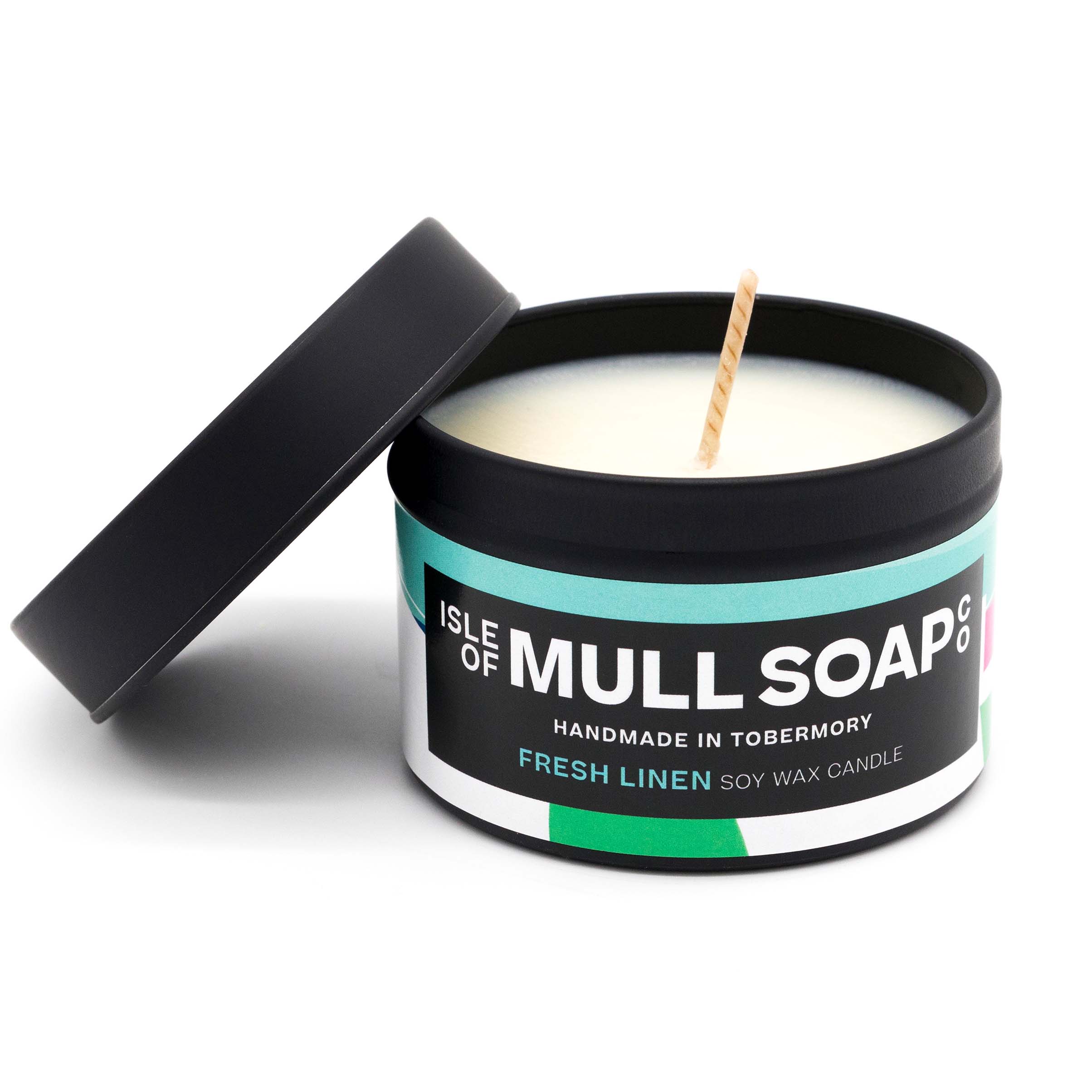 A black tin and lid with colourful funky label. fresh linen soy candle handmade in Tobermory by the Isle of Mull Soap Co