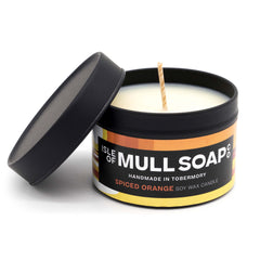 A black tin and lid with colourful funky label. spiced orange soy candle handmade in Tobermory by the Isle of Mull Soap Co